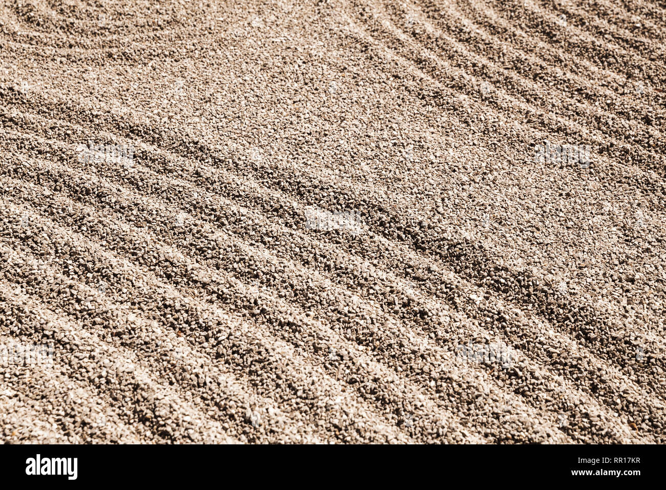 Zen pattern on the sand in the Japanese rock garden, background photo texture Stock Photo