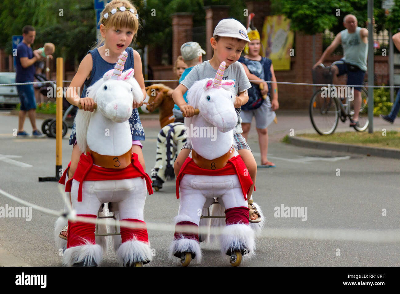 Tunder Fesztival (Fairies' Festival) in Sopron, Hungary on 24 June 2017 - boy and girl on ride on walking horse Stock Photo