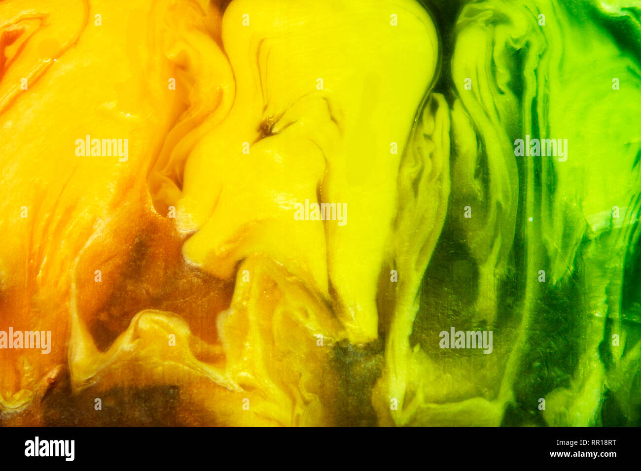 Сolorful piece of handmade semitransparent soap closeup, scenic yellow and green frozen forms Stock Photo