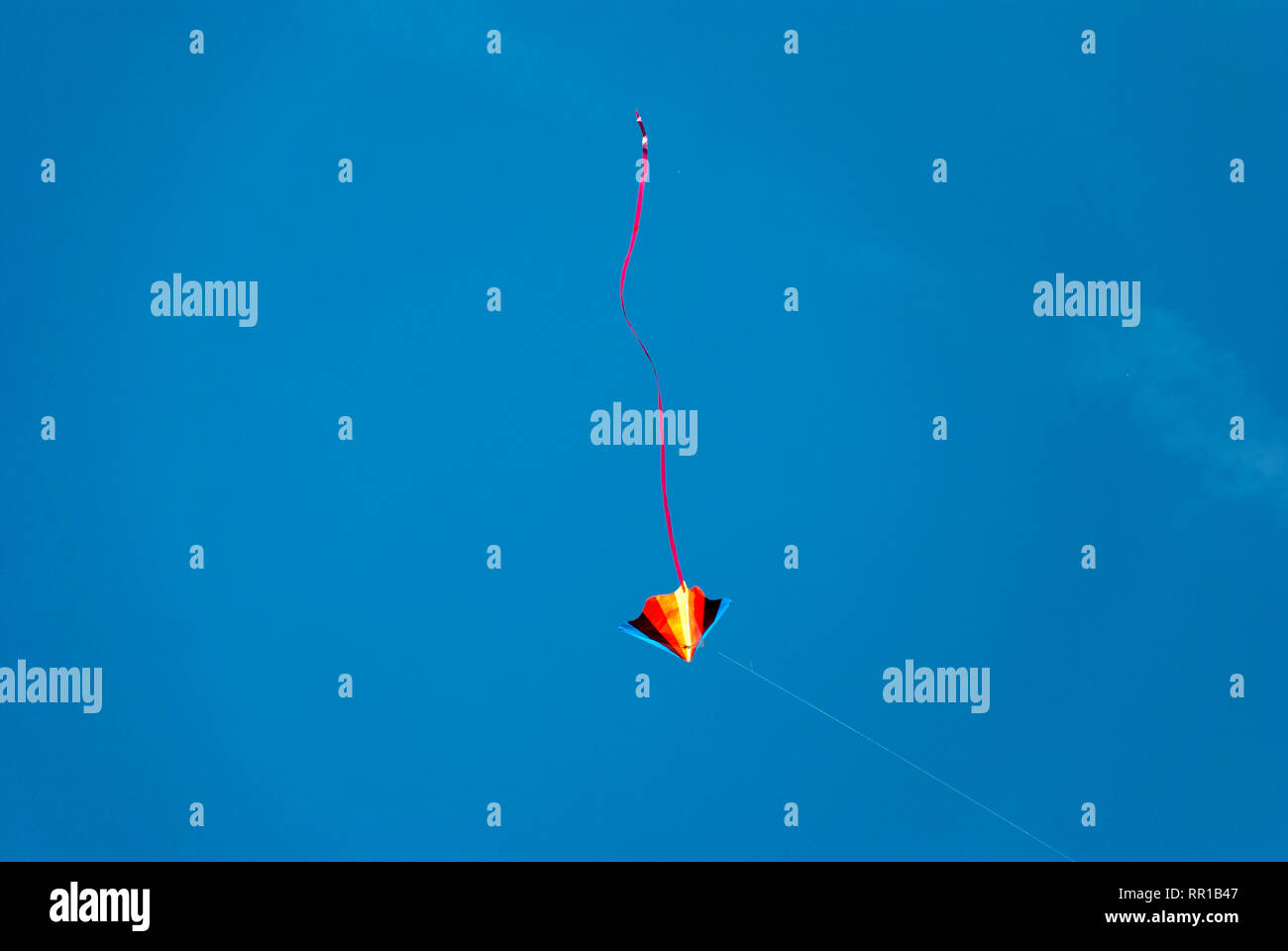 colorful kite in the blue sky Stock Photo - Alamy