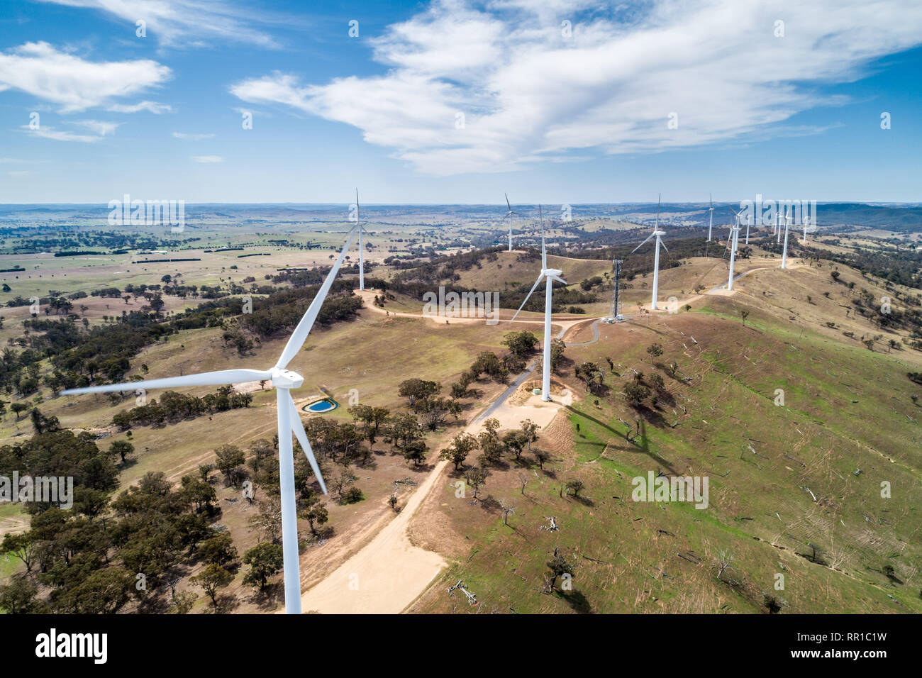 Aerial landscape of wind farm on a hill on bright sunny day in New ...