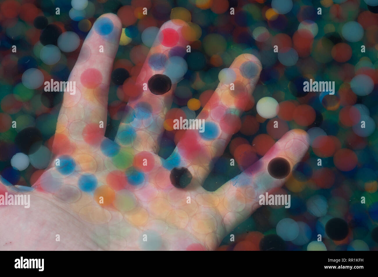 Water beads held in a hand Stock Photo