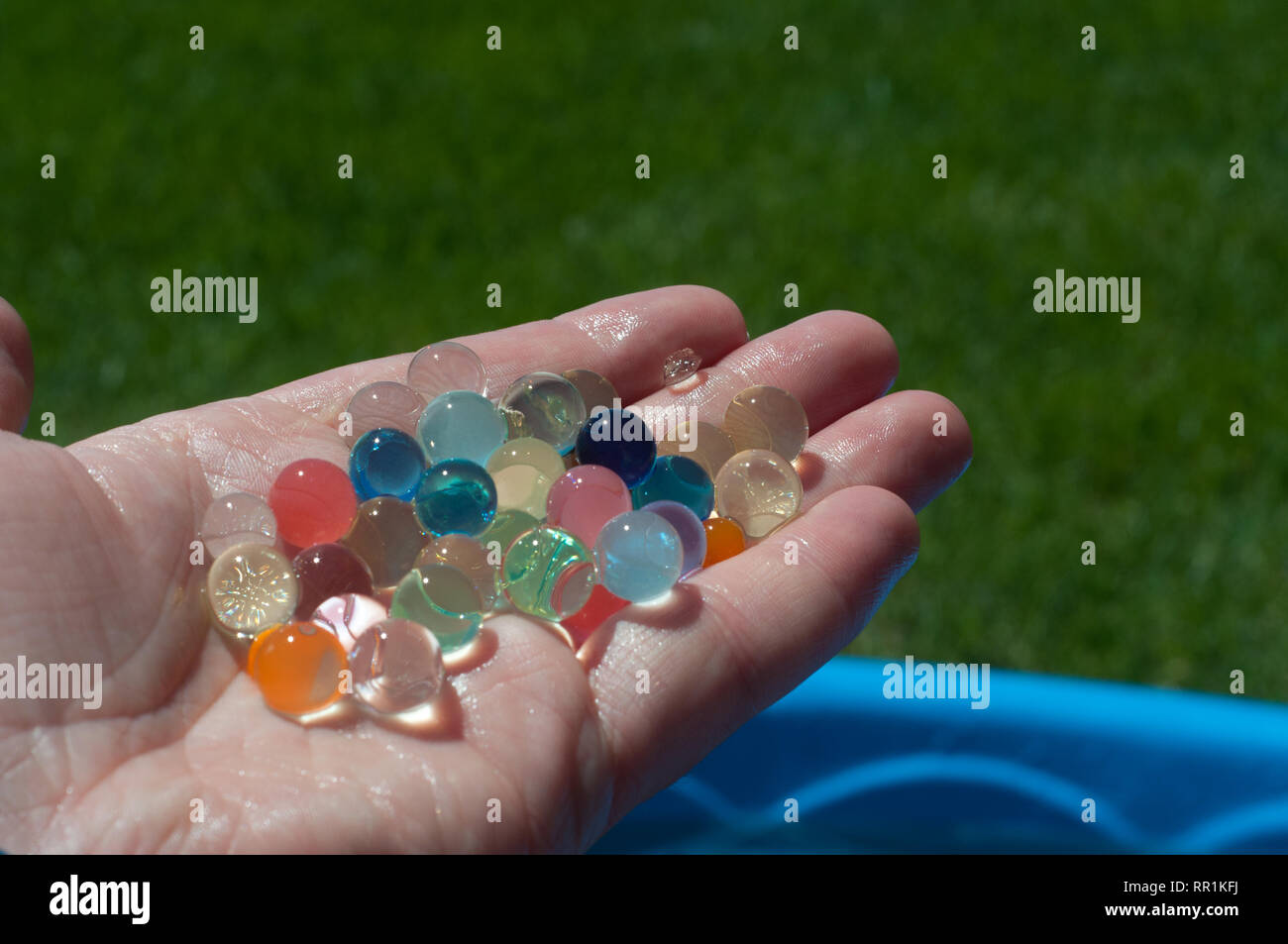 Water beads held in a hand Stock Photo
