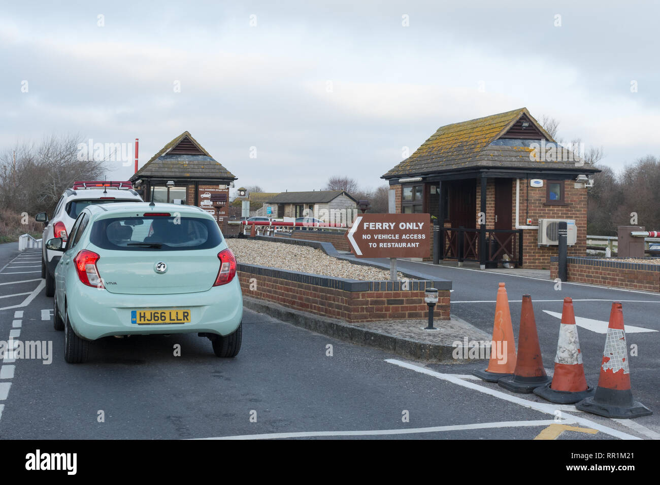 Cars queuing to pay the toll charge for the chain ferry from Shell Bay near Studland to Sandbanks in Dorset, UK Stock Photo