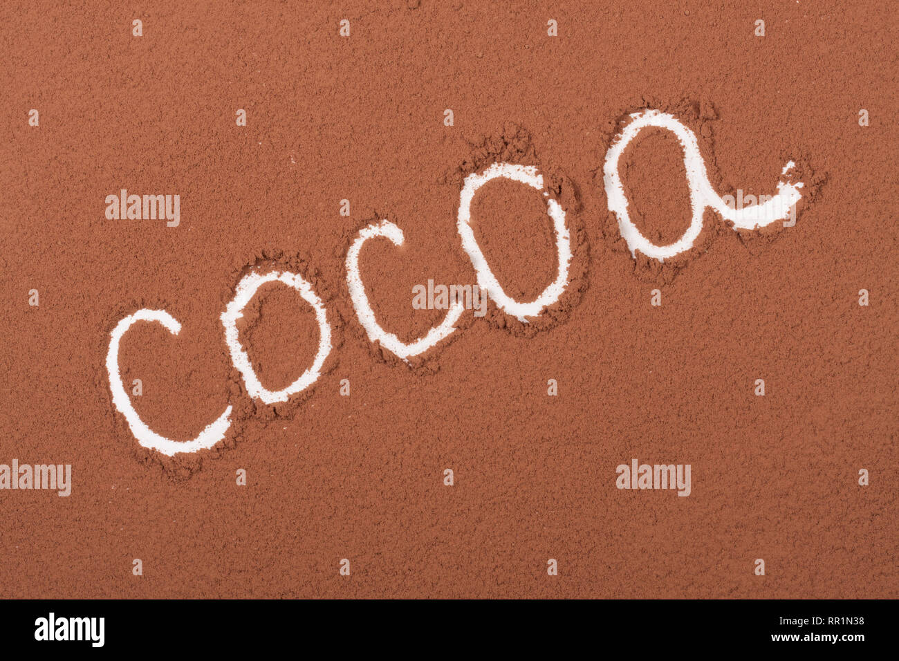 word cocoa written in cocoa powder as background Stock Photo Alamy