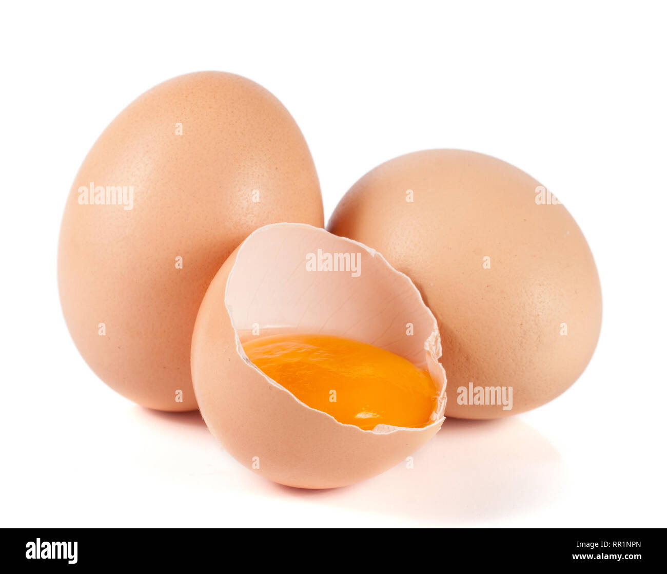 two whole eggs and broken egg isolated on white background Stock Photo