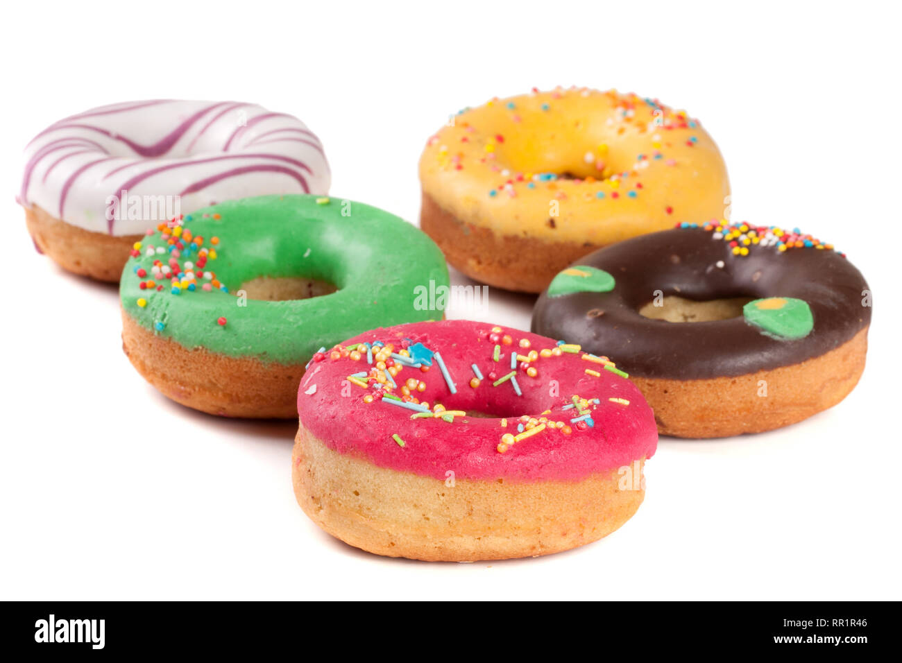 pile of glazed donuts isolated on white background Stock Photo - Alamy