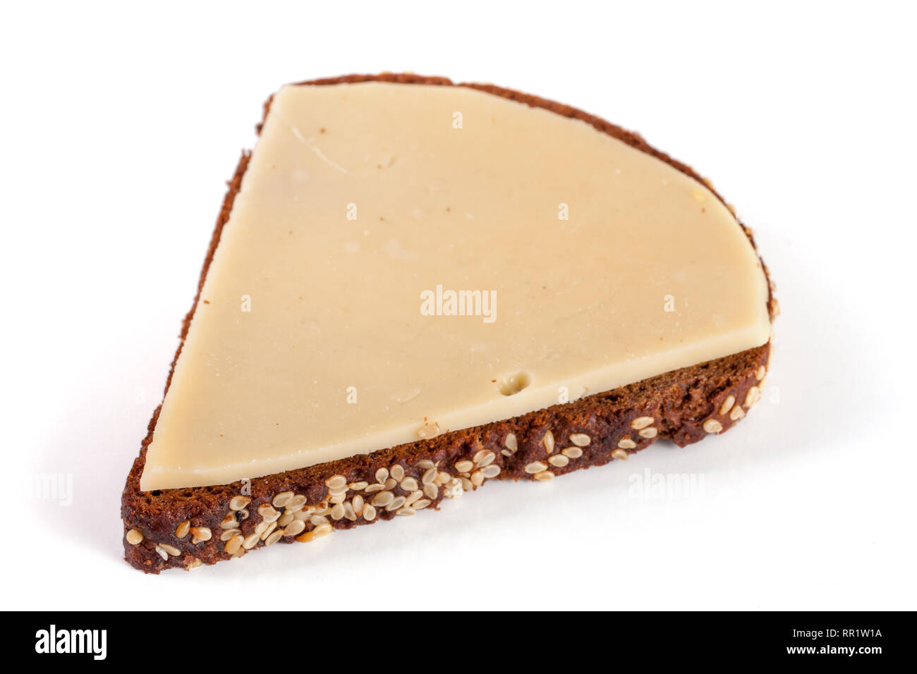slice of black bread with sesame seeds with cheese isolated on white ...