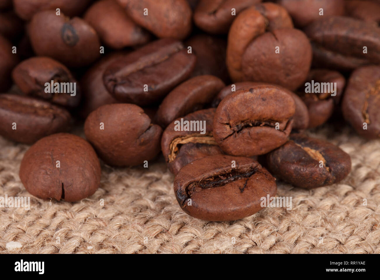 coffee beans on sackcloth close-up macro Stock Photo