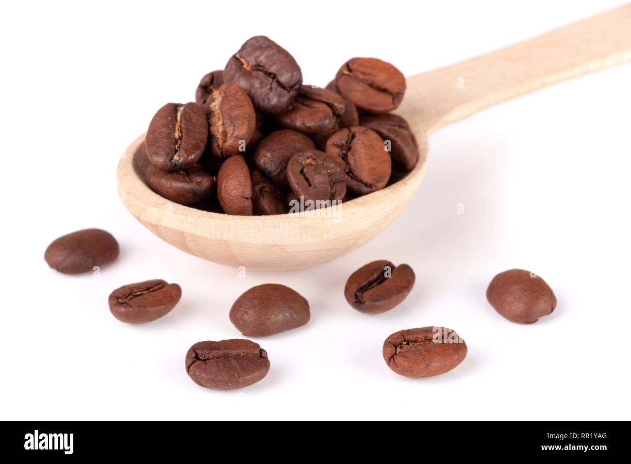 Coffee beans in a wooden spoon isolated on a white background Stock ...