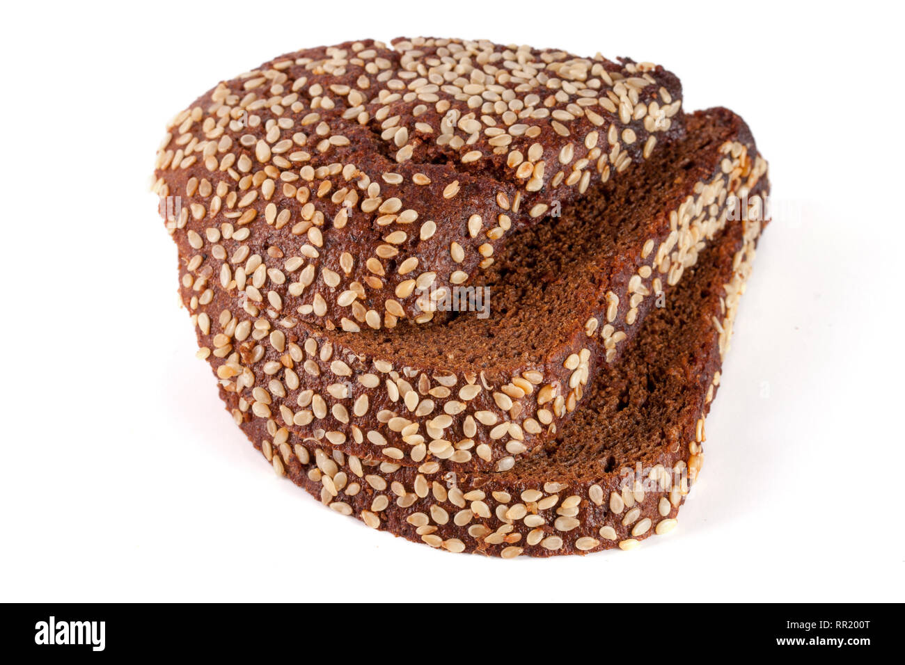 Three slices of black bread with sesame seeds isolated on white ...