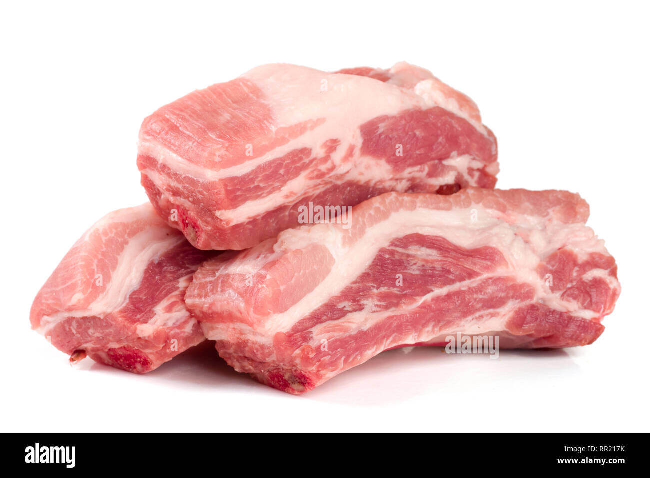 pieces of pork isolated on white background Stock Photo - Alamy
