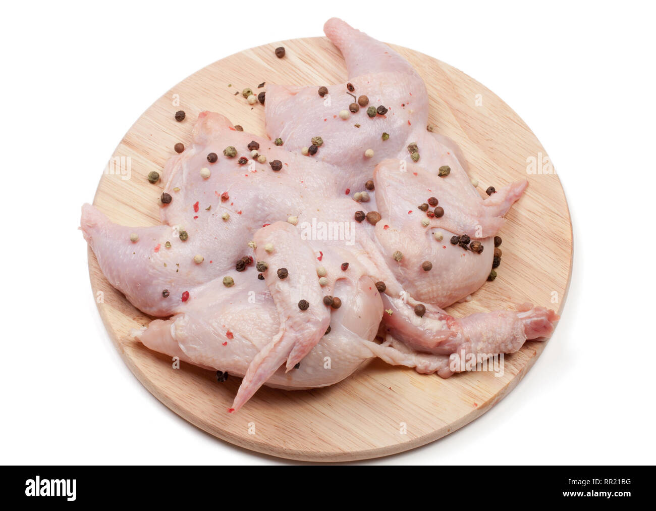 raw chicken carcass on the cutting board isolated on white background