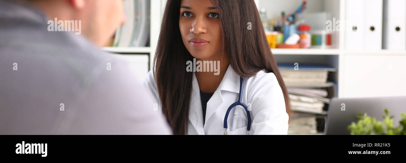 Friendly female doctor hold male patient Stock Photo