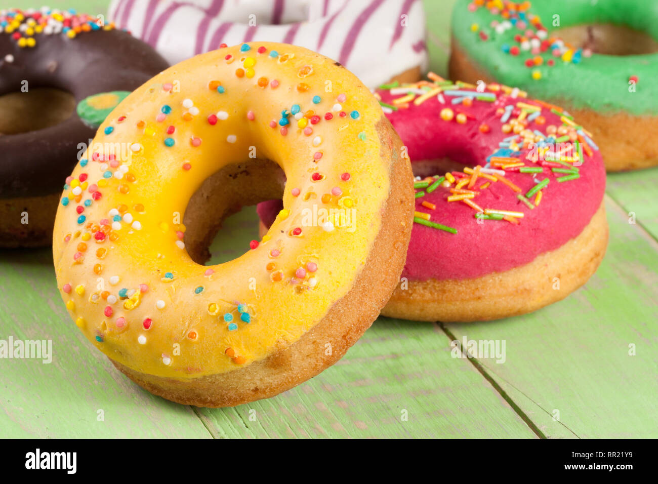 pile of glazed donuts isolated on white background Stock Photo - Alamy