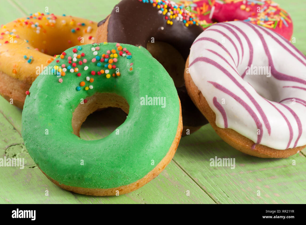 pile of glazed donuts isolated on white background Stock Photo - Alamy