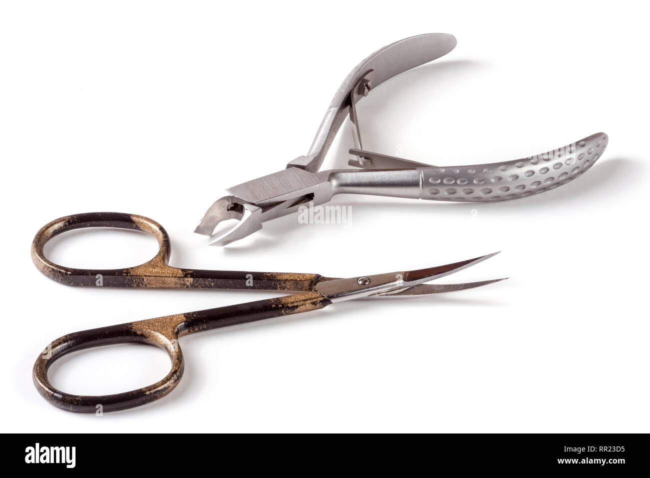 nail scissors and clippers to remove the cuticle care products isolated