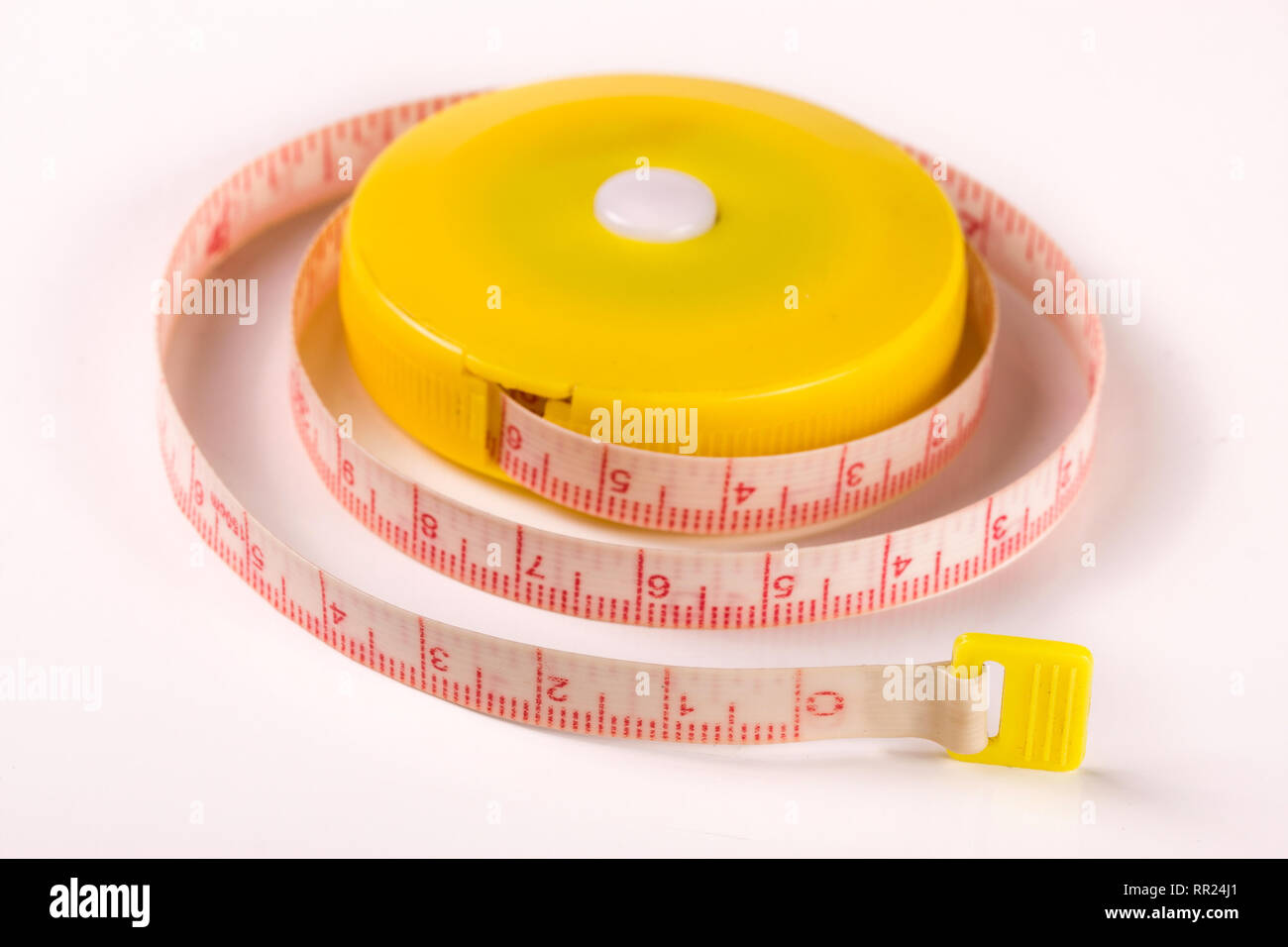tailor's meter or automatic tape measure isolated on a white background Stock Photo