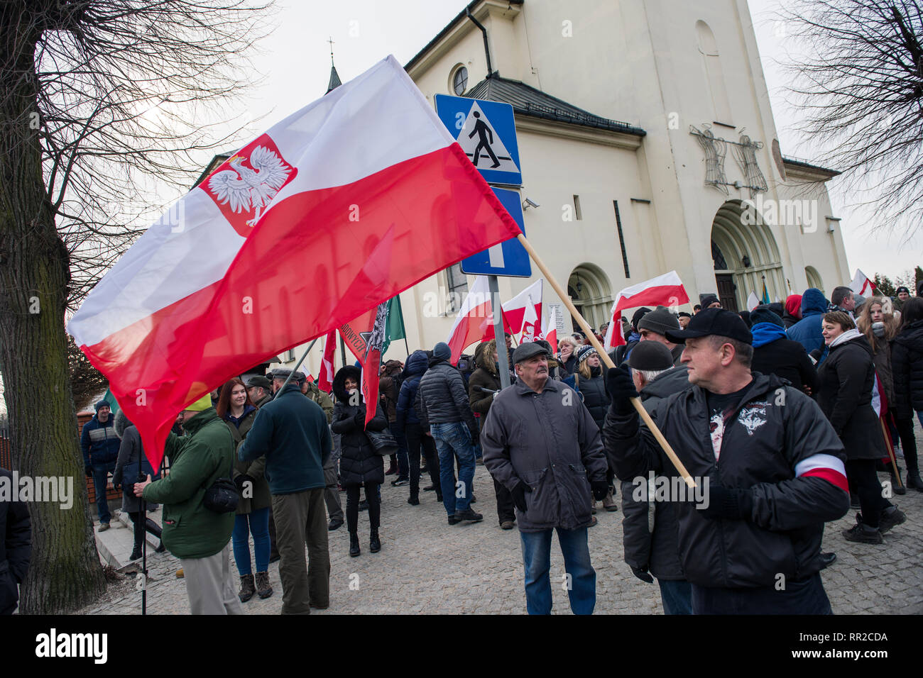 A nationalist is seen waving the Polish flag during the march. Polish nationalists organized a commemorative march of the “Cursed Soldiers” in the city of Hajnowka next to the Belarusian border. The Cursed Soldiers also known as the Doomed Soldiers were anti-communist resistant fighters after WWII, however they were also famous of committing crimes against civilians, mostly ethnic Belarusians. Stock Photo