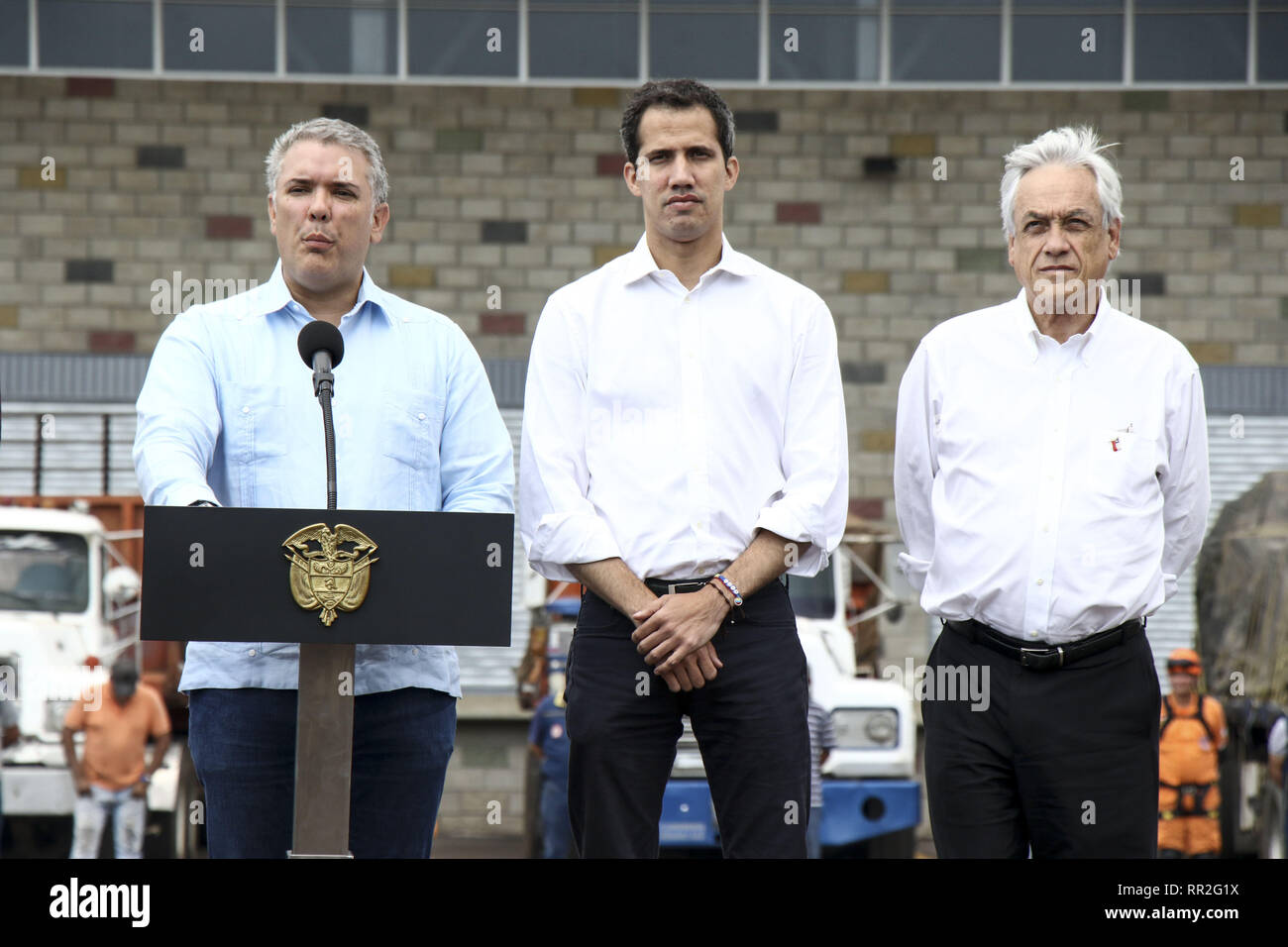 Caracas, Venezuela. 23rd Feb, 2019. Venezuelan opposition leader Juan Guaido (C), flanked by presidents Mario Abdo Benitez (2nd-L) of Paraguay, Ivan Duque (2nd-R) of Colombia and Sebastian Pinera (R) of Chile, and Organization of American States Secretary-General Luis Almagro (L), speaks in an official ceremony in Cucuta on the Colombian side of the Tienditas International Bridge before the attempt to cross humanitarian aid over the border into Venezuela, on February 23, 2019. US-donated humanitarian aid was ''on its way'' to Venezuela, opposition leader Juan Gauido announced Saturday as Stock Photo