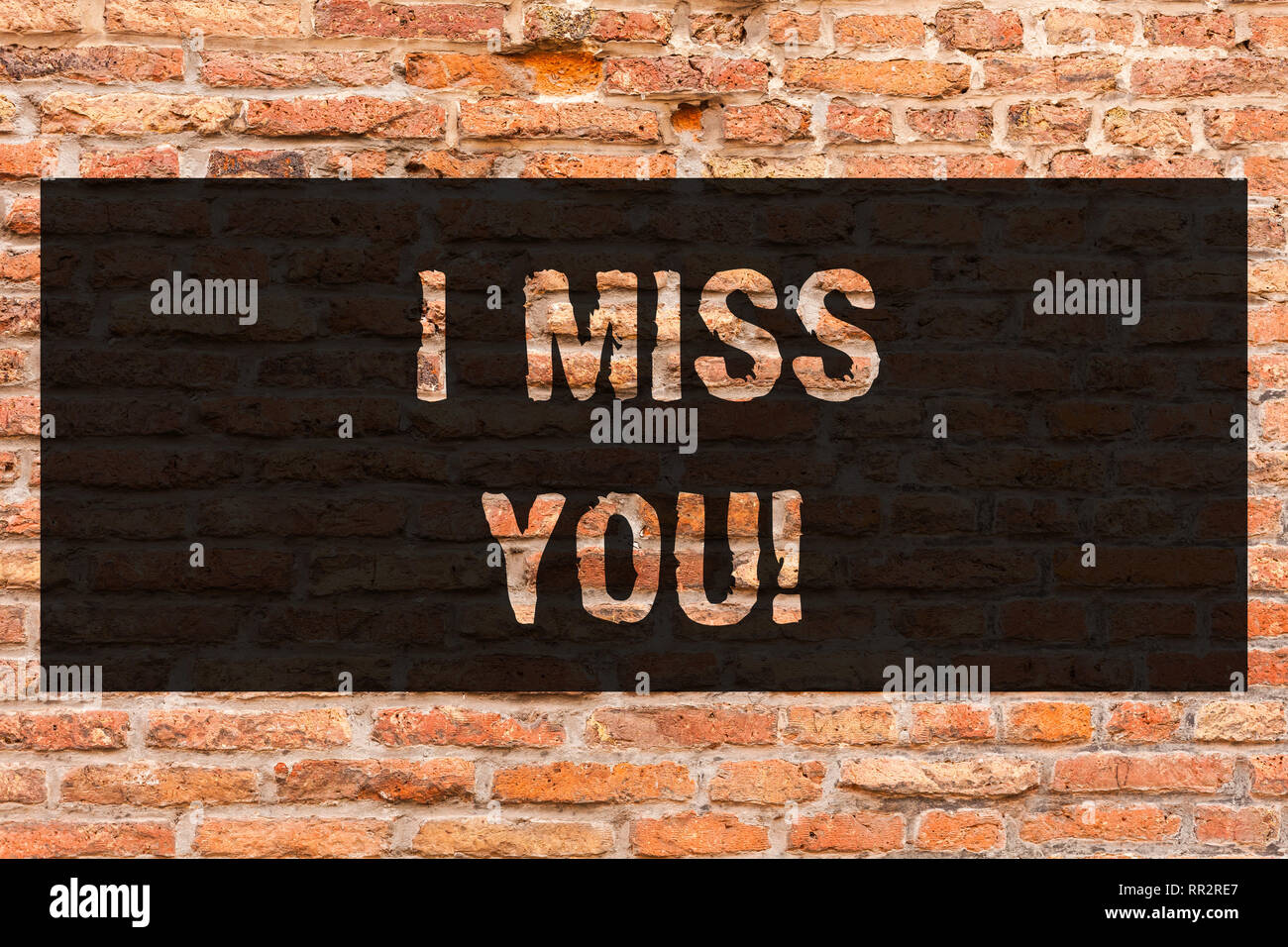 Writing note showing I Miss You. Business photo showcasing Feeling sad  because you are not here anymore loving message Brick Wall art like Graffiti  mo Stock Photo - Alamy