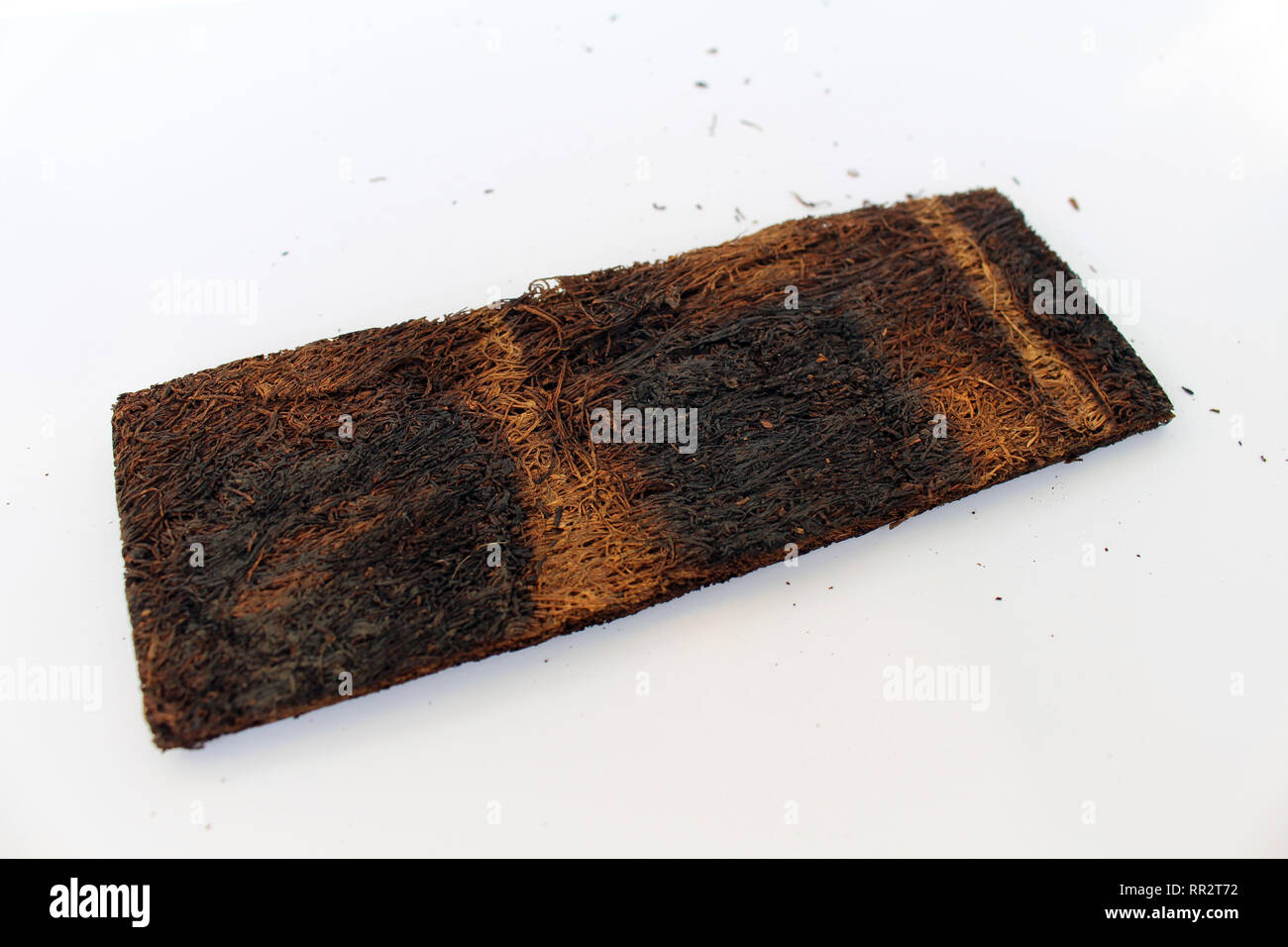 A slice of pressed tobacco that grows in Indonesia. A closeup view Stock  Photo
