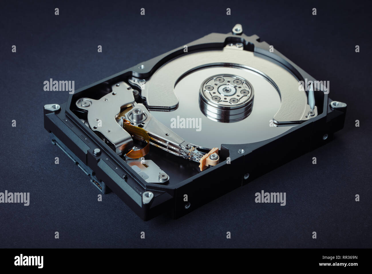 disassembled computer hard drive on black background Stock Photo