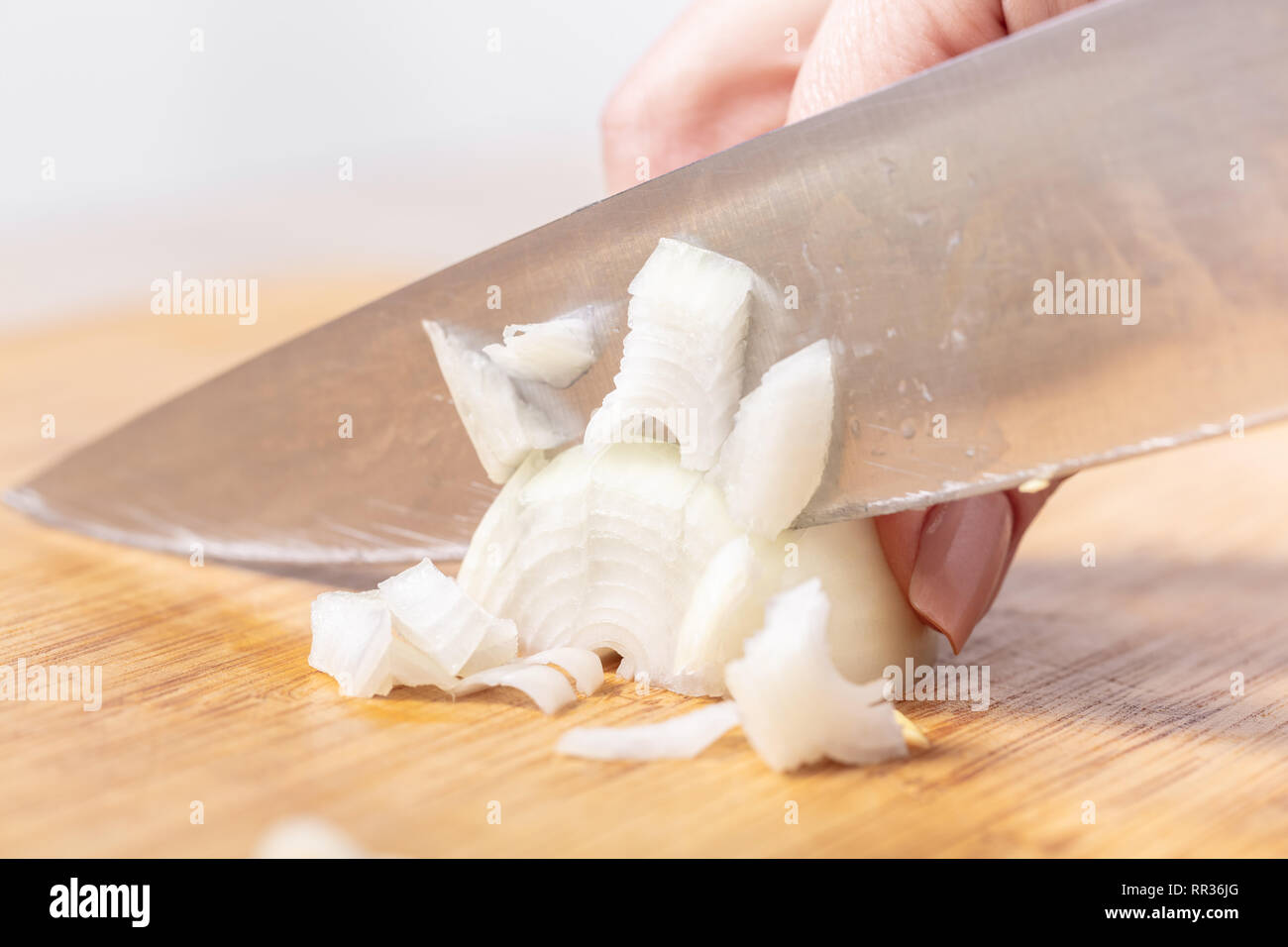 Female cook knife cuts onion hi-res stock photography and images - Alamy