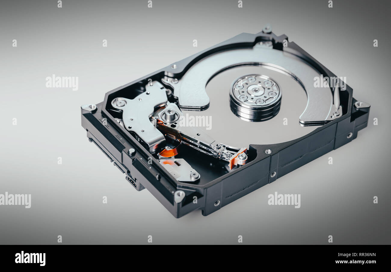 disassembled computer hard drive on black background Stock Photo