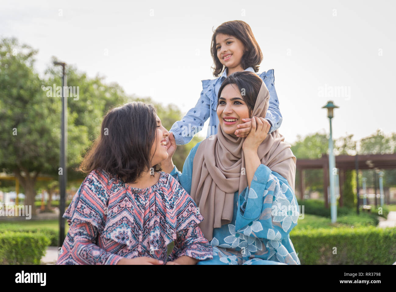 Happy arabian family having fun in Dubai Mom together with her