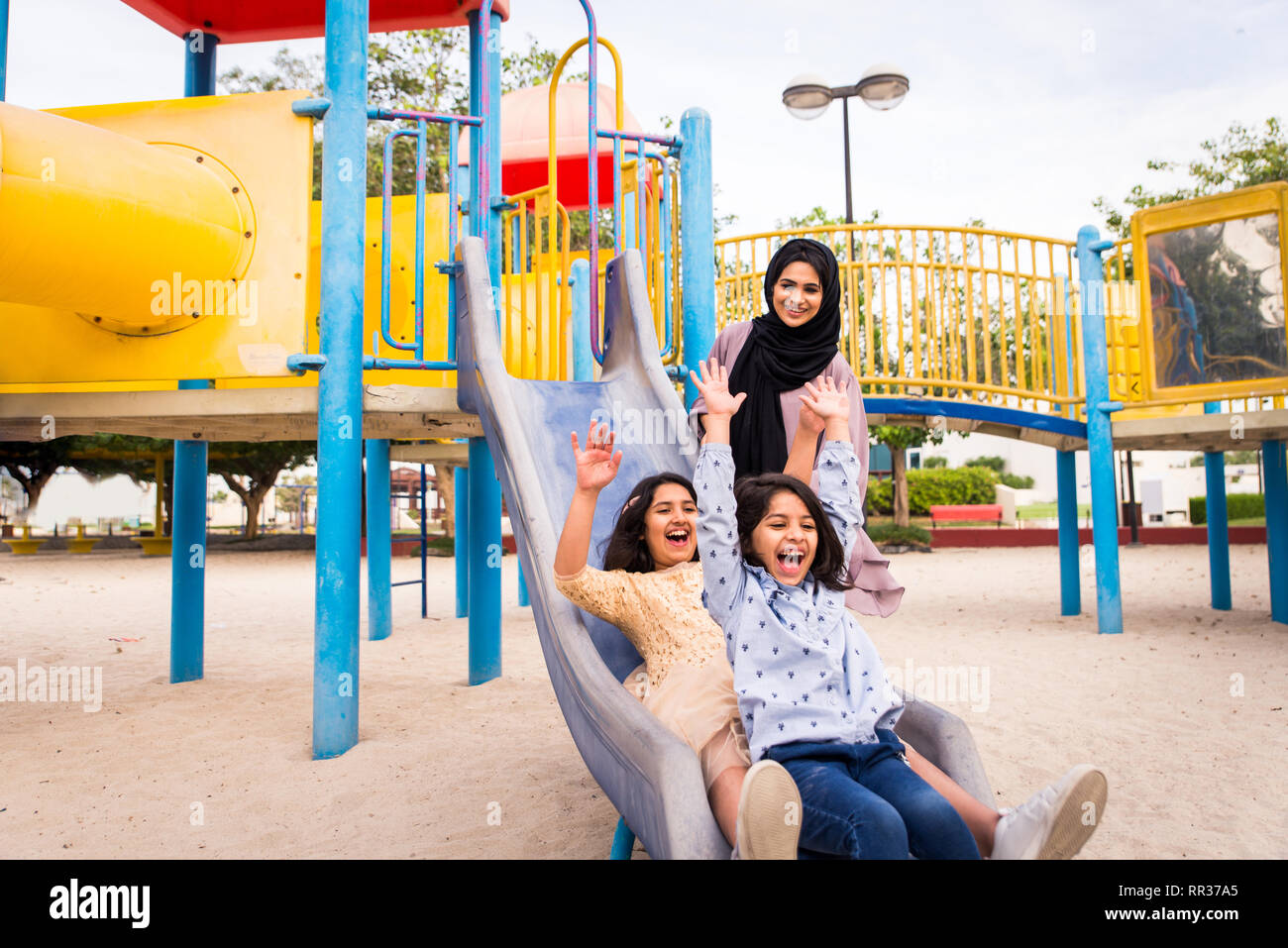 Happy arabian family having fun in Dubai Mom together with her