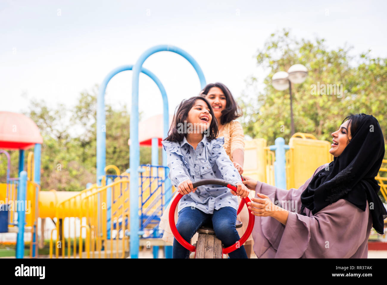 Happy arabian family having fun in Dubai Mom together with her