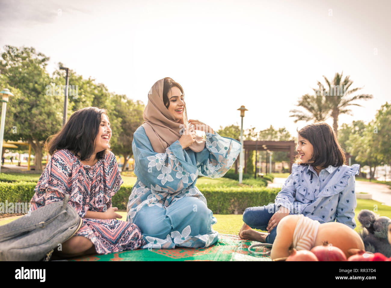 Happy arabian family having fun in Dubai Mom together with her