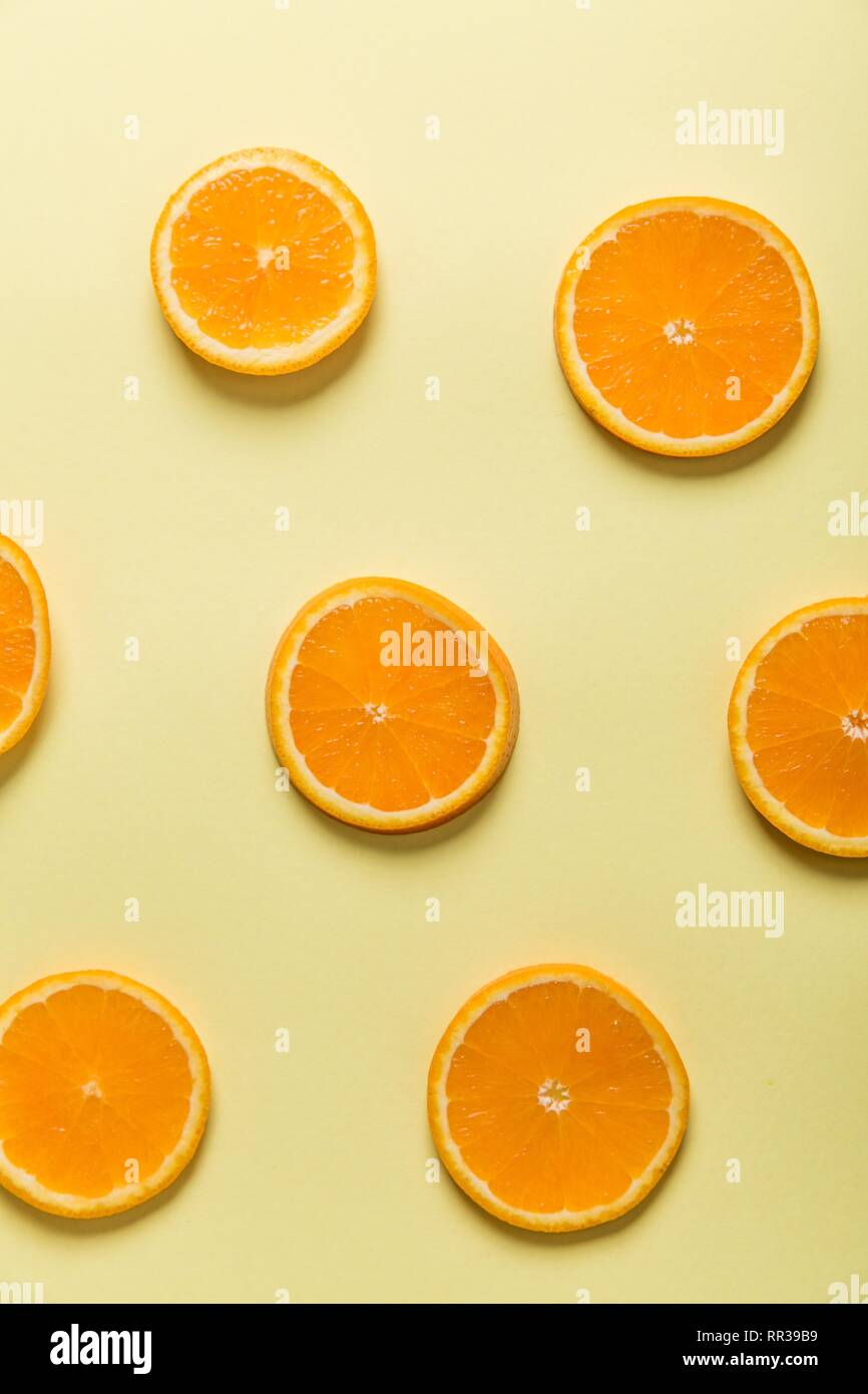 Download Orange Slices On A Pastel Yellow Background Stock Photo Alamy Yellowimages Mockups