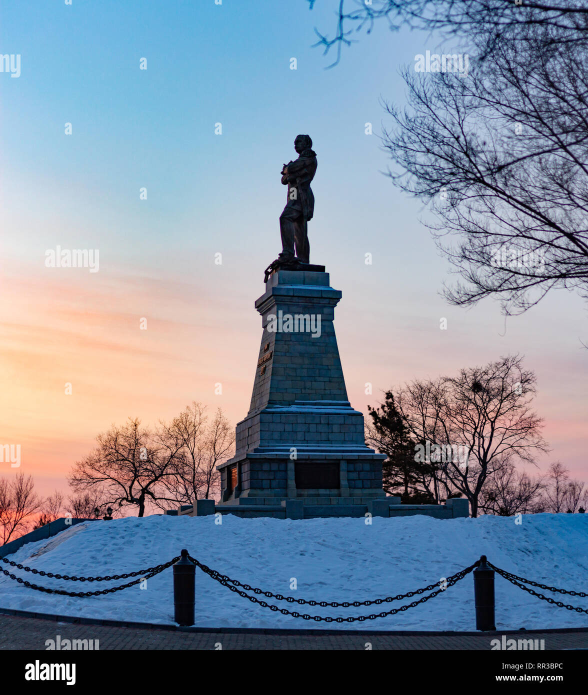Monument to count Muraviev of the Amur near the Cliff in Khabarovsk, Russia, at sunset. Beautiful sky at sunset. Stock Photo