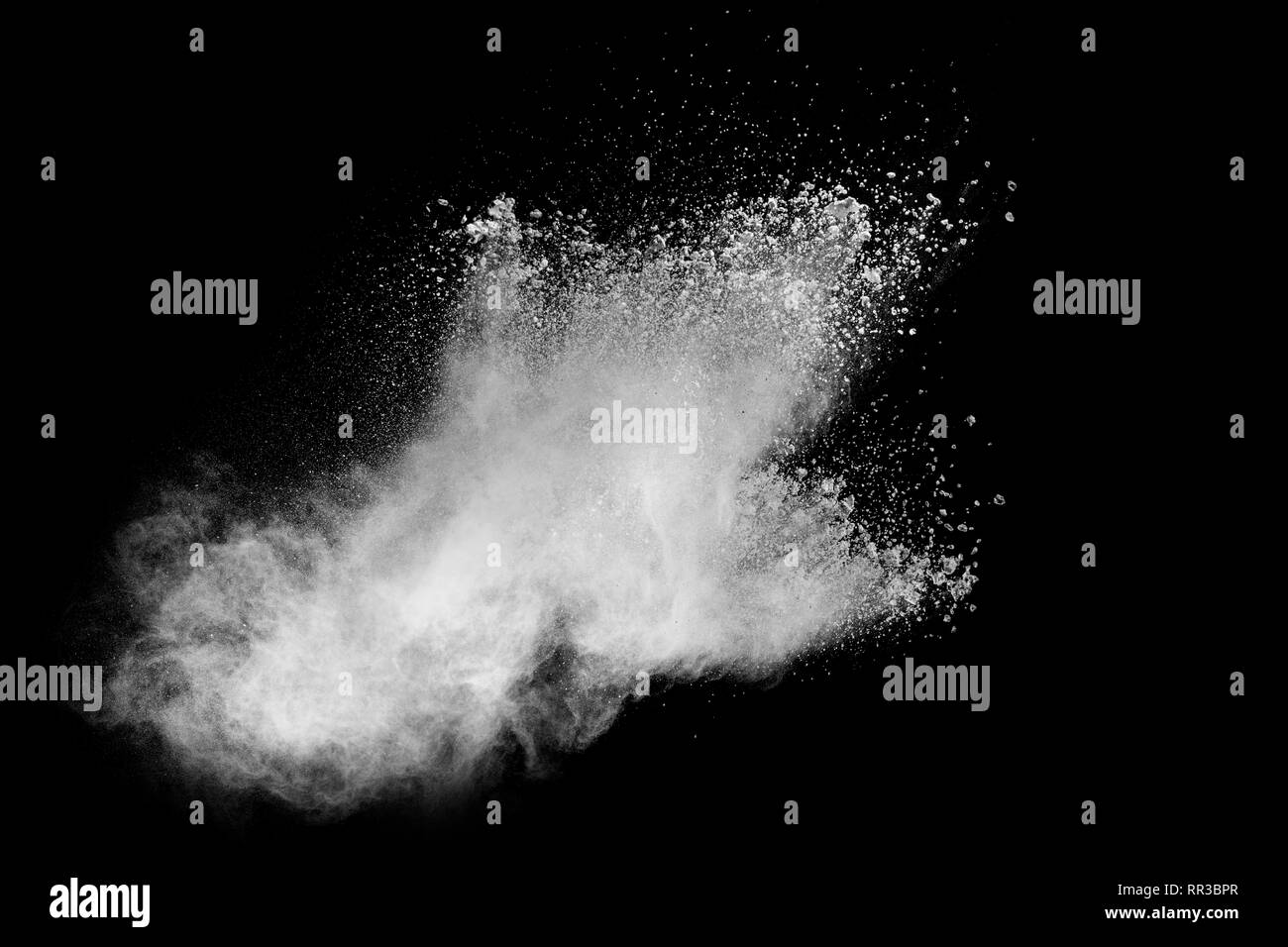 White powder explosion isolated on black background. White dust ...