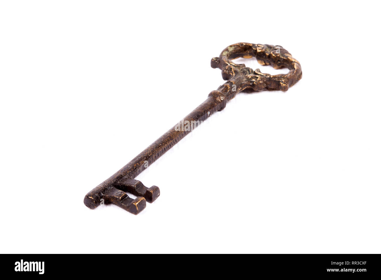 Antique key isolated on white background - photograph Stock Photo - Alamy