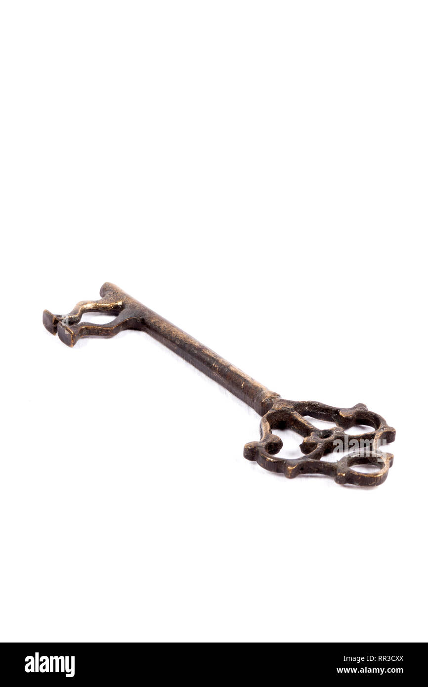 Antique key isolated on white background - photograph Stock Photo - Alamy