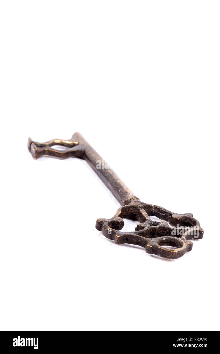 Antique key isolated on white background - photograph Stock Photo - Alamy