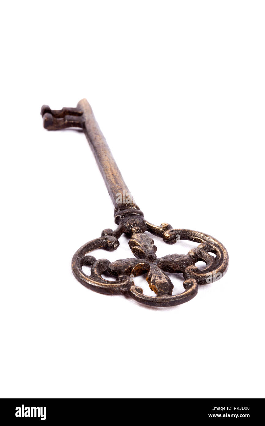 Antique key isolated on white background - photograph Stock Photo - Alamy