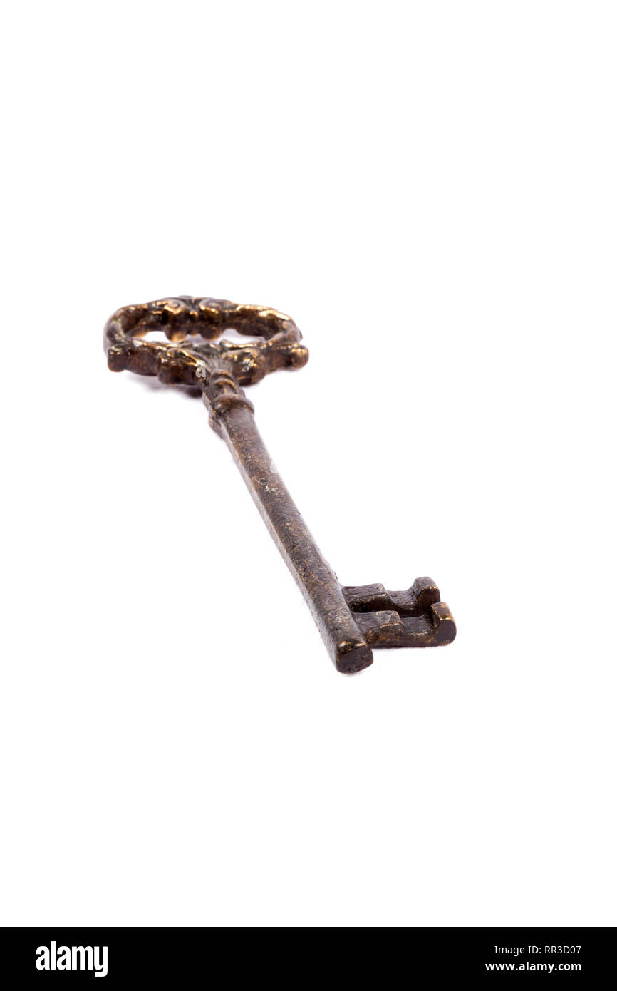 Antique key isolated on white background - photograph Stock Photo - Alamy
