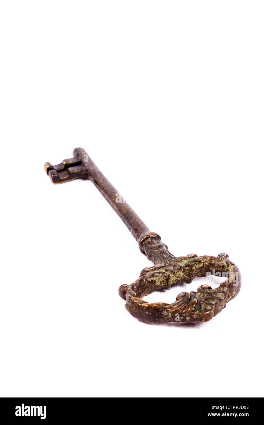 Antique key isolated on white background - photograph Stock Photo - Alamy