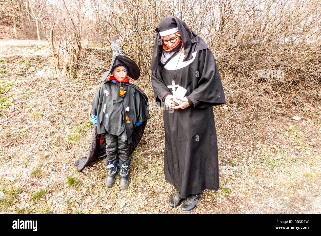 Czech carnival - masopust, Woman mask, dressed as a nun and boy, Czech Republic Stock Photo