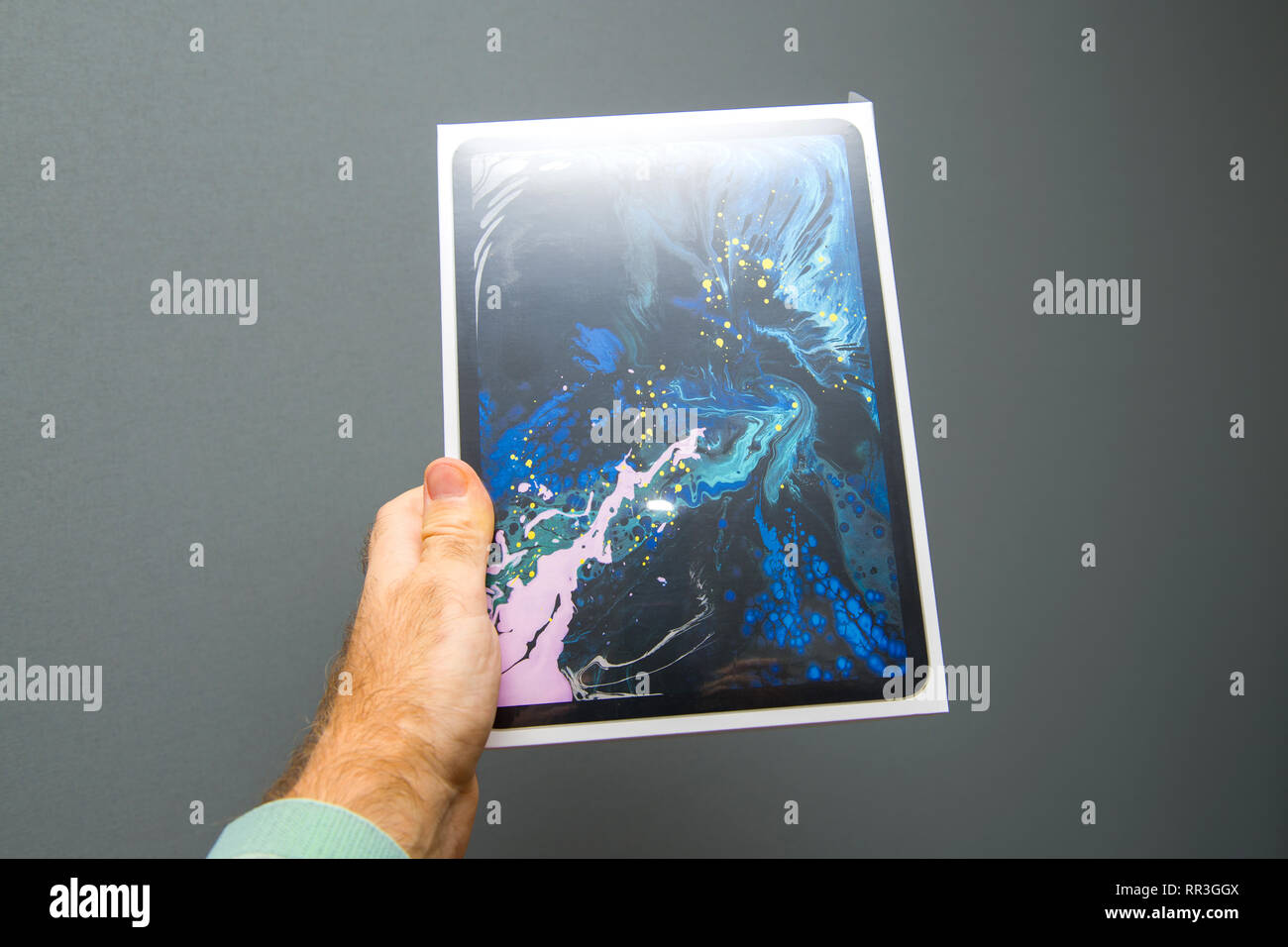 PARIS, FRANCE - NOV 16, 2018: Man installing Louis Vuitton City Guide app  on the latest iPad pro with Apple pencil after unboxing and setting-up the  new device Stock Photo - Alamy