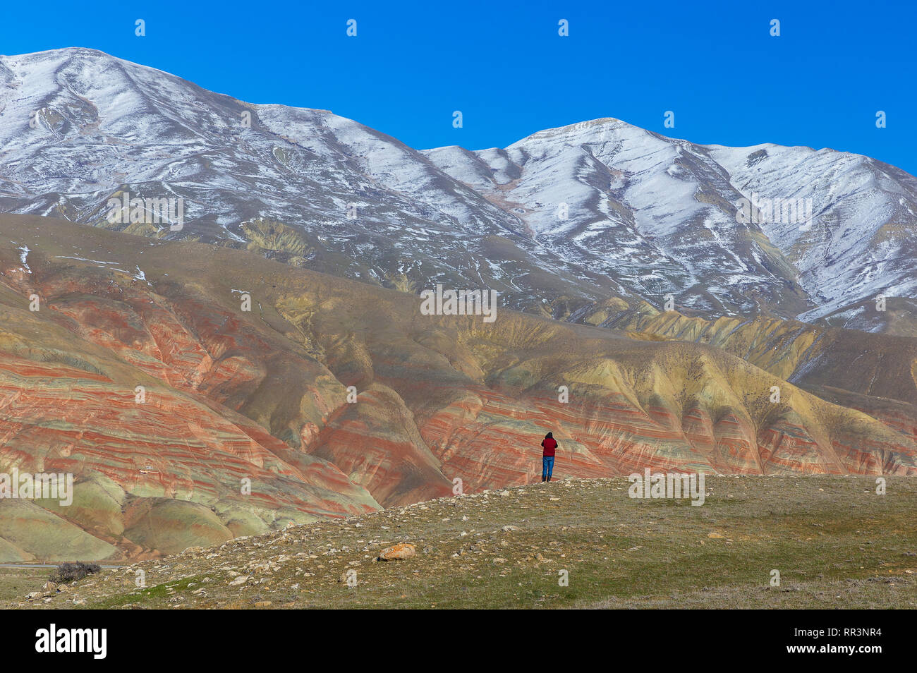 photographer takes pictures of winter red mountains Stock Photo