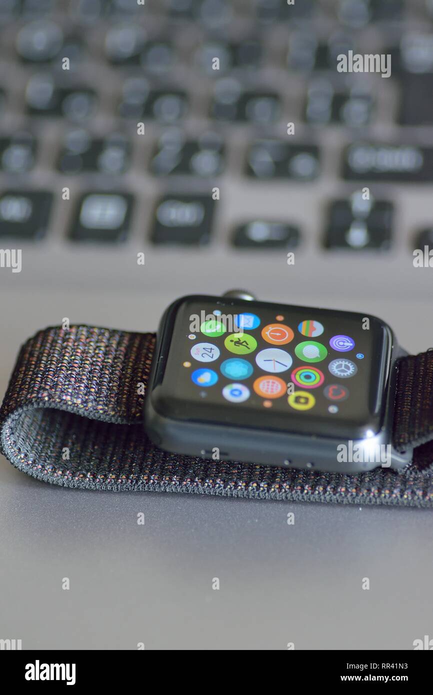 Apple Watch with blurred laptop PC keyboard background. Apple Watch is  industry leader smart watch brand Stock Photo - Alamy