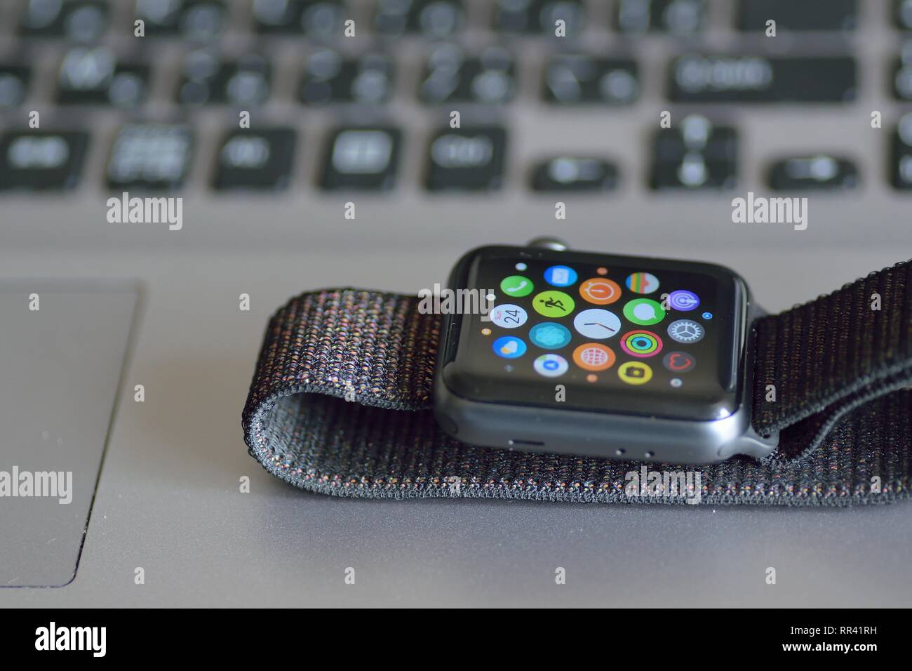Apple Watch with blurred laptop PC keyboard background. Apple Watch is  industry leader smart watch brand Stock Photo - Alamy