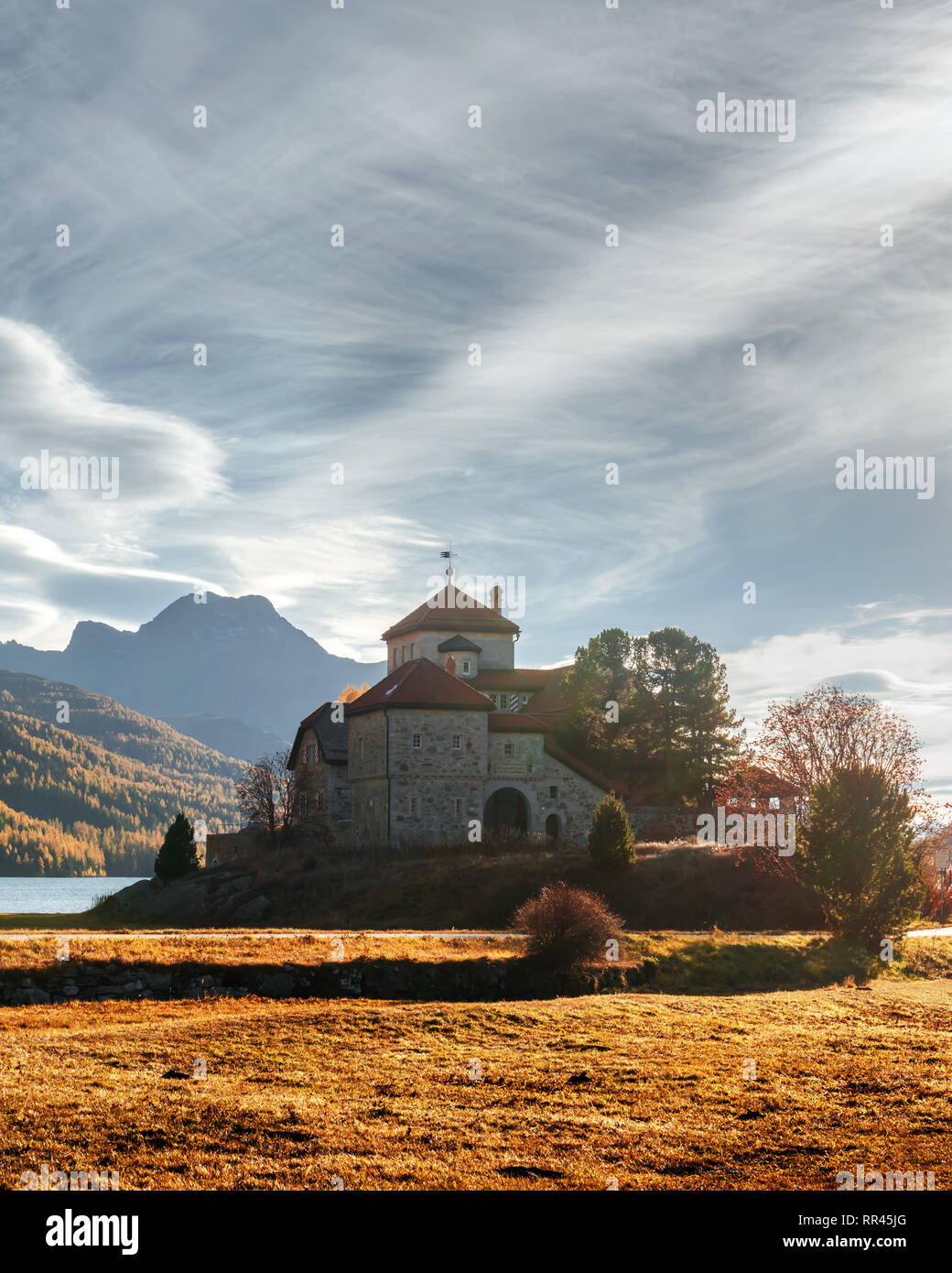 Amazing autumn sunny day at Champferersee lake in the Swiss Alps. Castle of Crap da Sass, Silvaplana village, Switzerland, Europe Stock Photo