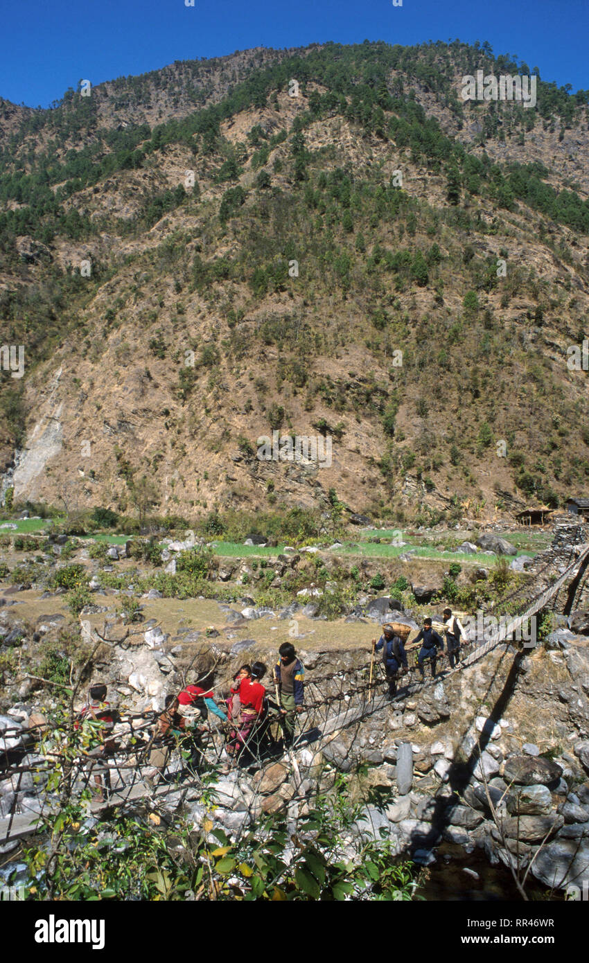 Nepal, Dolakha, hanging bridge in Himalaya mountains / Haengebrucke im Himalaja Stock Photo