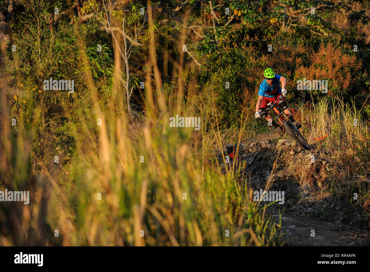 A man rides a mountain bike below the Strawberry Hill Resort in the